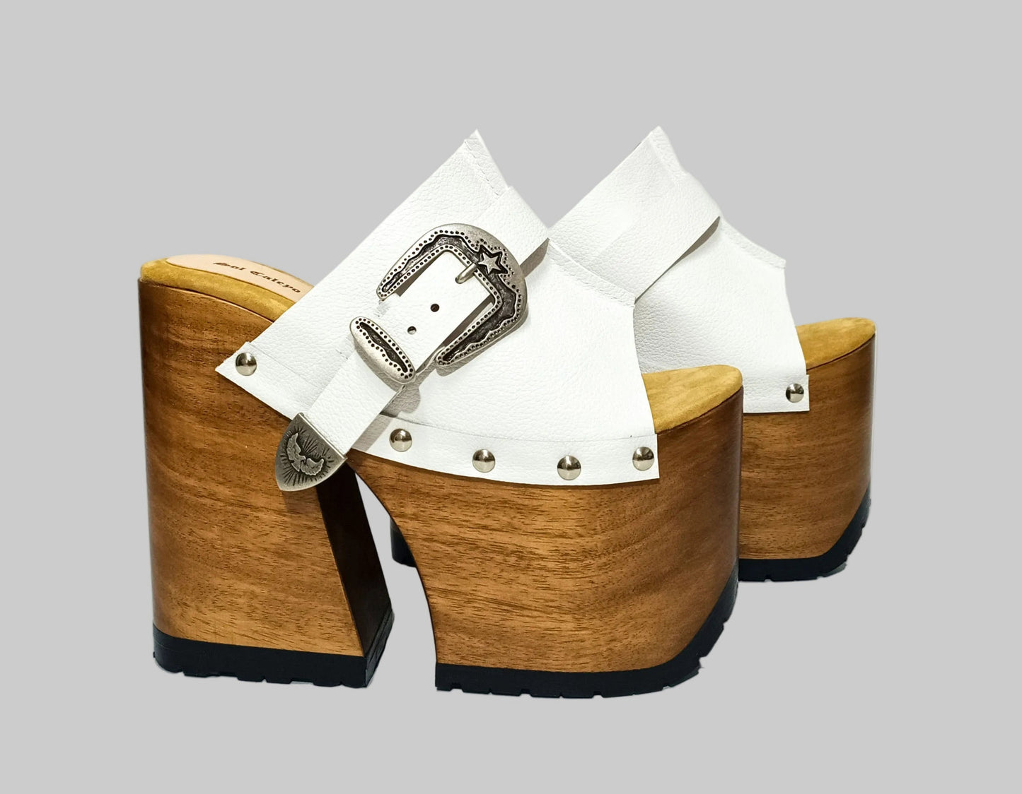 Individually handcrafted White Western Sandals showing the 17cm hand-carved wooden platform and ornate silver buckle on a white background.