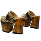 Profile view of Route 66 XL Snake Natural clogs with 17cm natural wood platform heel, snake print leather, and antique brass buckle.