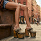 Handmade snake print leather mule clogs with brown straps, antique brass buckle and 17 cm natural wooden heel by Sol Caleyo