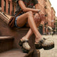 Handmade snake print leather mule clogs with brown straps, antique gold-tone buckle and 7 cm wenge wooden heel by Sol Caleyo