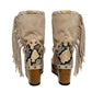 Atenea Flip Flop Boots by Sol Caleyo in neutral beige suede, featuring boho fringes, shell decorations, snake-print heel, and a tall wooden platform sole.