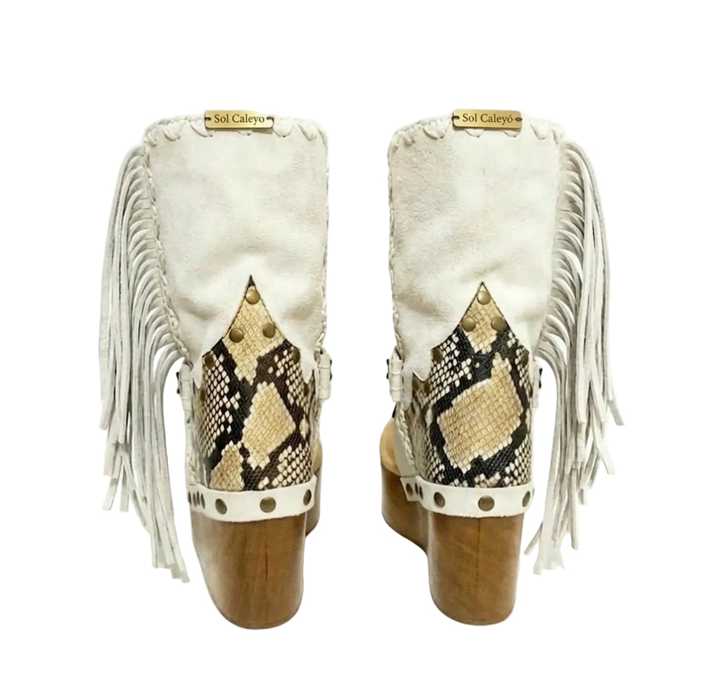 Atenea White Flip Flop Boots by Sol Caleyo, featuring premium white suede, bohemian fringe, shell decorations, and a chunky wooden platform heel against a white background.
