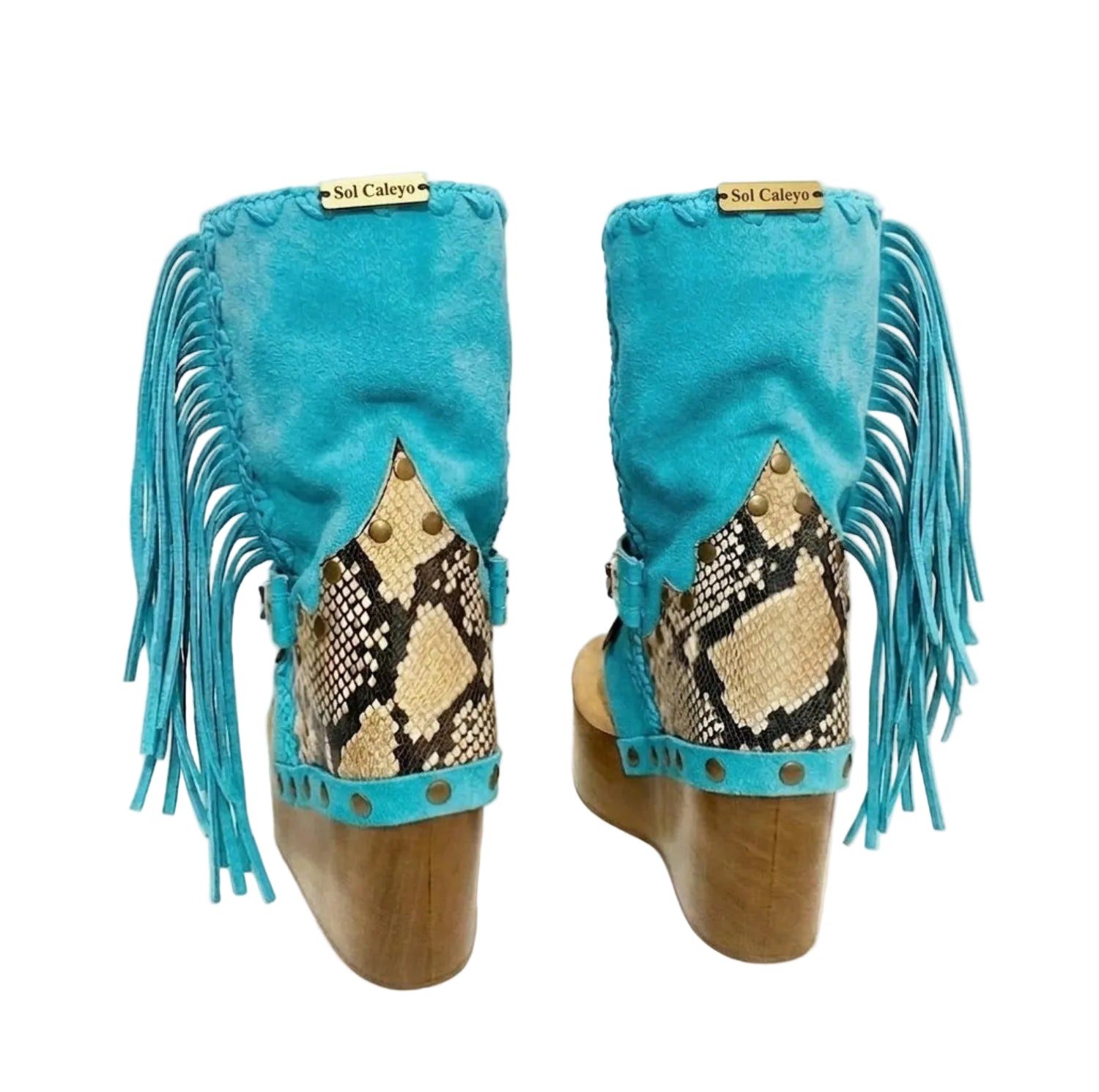 Handmade Atenea Turquoise Flip Flop Boots by Sol Caleyo, featuring vibrant turquoise suede, bohemian fringes, shell embellishments, and a tall wooden platform.