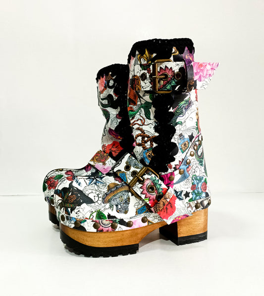 Handmade tattoo print leather biker platform boots with antique-gold buckles, heel rivets and 6.5 cm wooden heel by Sol Caleyo.