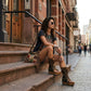 Handmade tiger print leather flip flop wedge boots with old-gold pyramid studs, metallic buckles and 10 cm wooden wedge by Sol Caleyo.