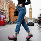 Handmade UK flag patchwork leather open-back wedge mule clogs with antique-gold studs and 7 cm wooden wedge by Sol Caleyo.