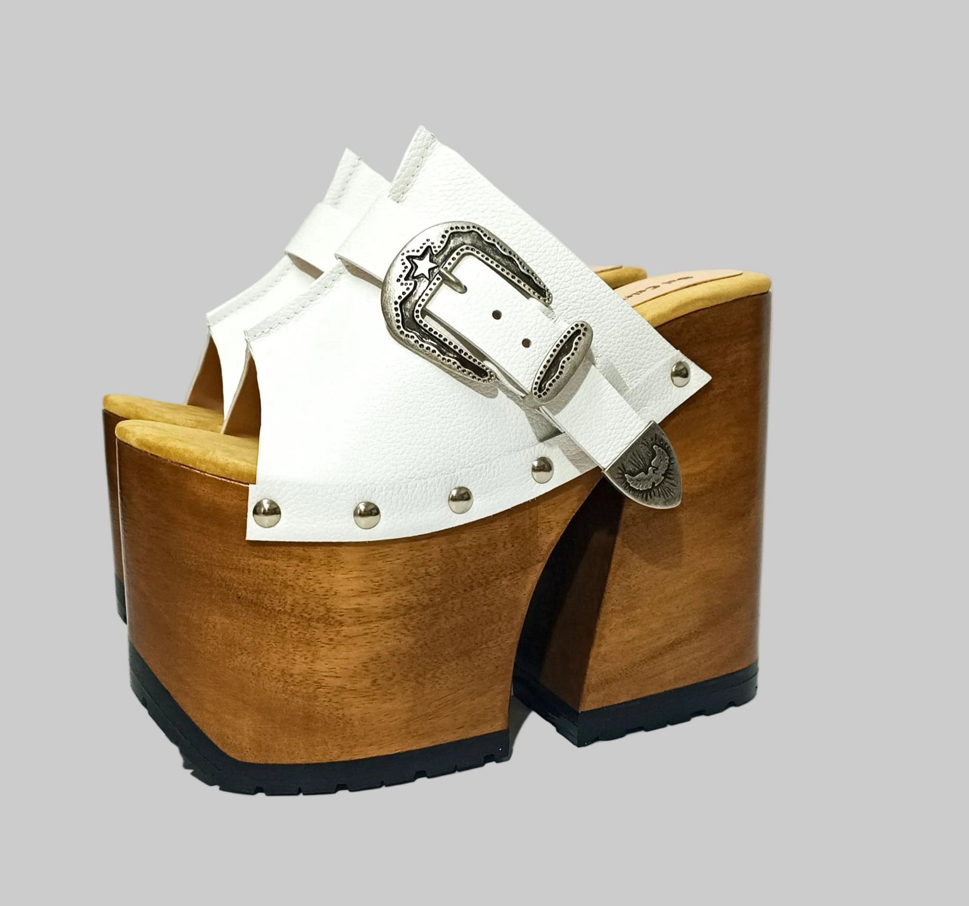Individually handcrafted White Western Sandals showing the 17cm hand-carved wooden platform and ornate silver buckle on a white background.