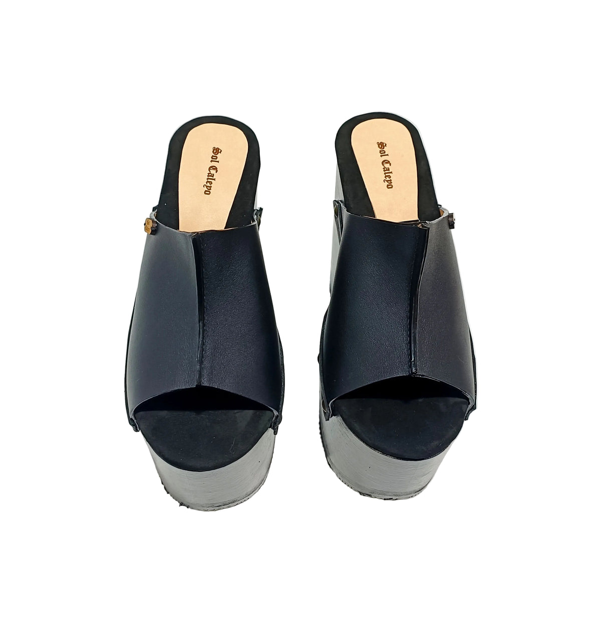 Vintage 70s-style black leather clogs with super high wooden wedge heels. Handmade to order.
Available in sizes 34 to 47.
An exclusive design by Sol Caleyo, created for those who value craftsmanship, comfort, and authentic style.