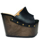 Vintage 70s-style black leather clogs with super high wooden wedge heels. Handmade to order.
Available in sizes 34 to 47.
An exclusive design by Sol Caleyo, created for those who value craftsmanship, comfort, and authentic style.
