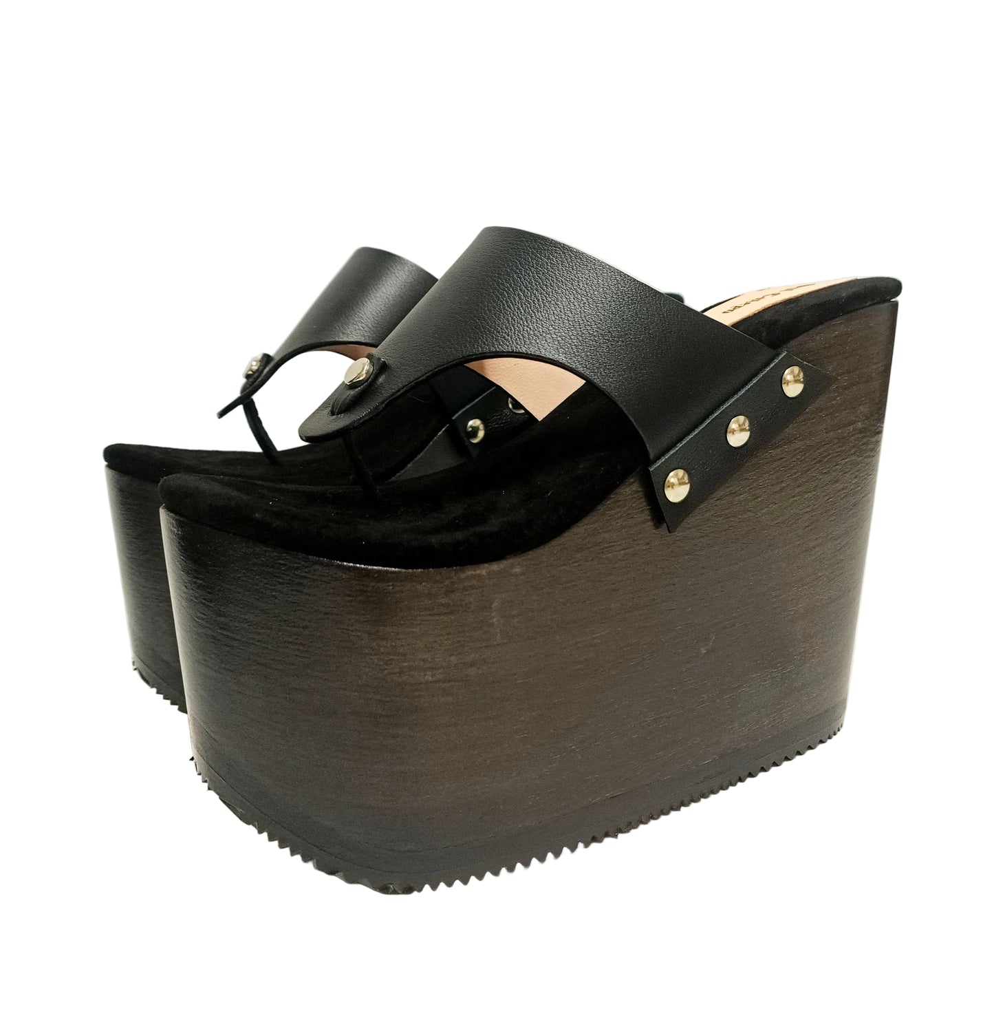 Pair of Sol Caleyo Kauai XL handcrafted flip flop sandals featuring black genuine leather straps, silver studs, and a high wengue-colored wooden platform sole.