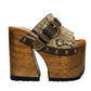 Sol Caleyo handmade Western platform clogs in exotic snake-print leather with 17cm wooden heel and antique-brass concho buckle details.