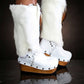 White fur boots with wooden wedge. White bohemian style leather boots. Handmade clogs shoes. White fur boots decorated with feathers, natural shells and horns. High-end handmade footwear by Sol Caleyo. Handmade Furry Shoes.