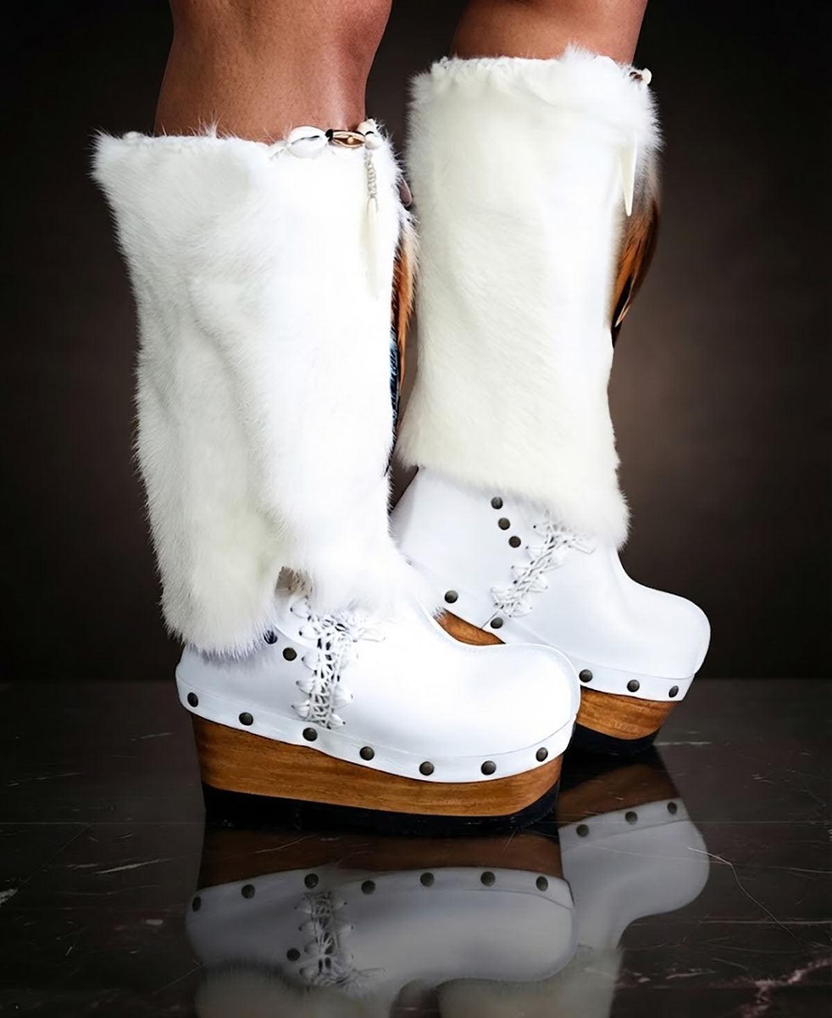 White fur boots with wooden wedge. White bohemian style leather boots. Handmade clogs shoes. White fur boots decorated with feathers, natural shells and horns. High-end handmade footwear by Sol Caleyo. Handmade Furry Shoes.