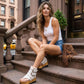 White handmade leather flip flop wedge boots with crochet trim, old-gold pyramid studs and 10 cm wooden wedge by Sol Caleyo.