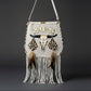 Handmade boho suede bag with hand-painted embroidered buffalo head, fringe, shells and feathers by Sol Caleyo.