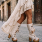 Hand painted buffalo, shells and feathers on handmade white suede boho boots by Sol Caleyo