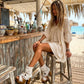 Handmade white split suede open toe boho platform ankle boots with fringe, shells, old-gold coins, carved bone and 12 cm natural lacquered wooden heel by Sol Caleyo.