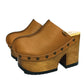 Brown leather clogs in a vintage 70s style. Super high vintage-style wooden heel. Sizes 33 to 47. High-end footwear handmade by Sol Caleyo.