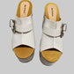 Individually handcrafted White Western Sandals showing the 17cm hand-carved wooden platform and ornate silver buckle on a white background.