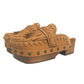 Side profile of Sol Caleyo Niza Clogs in light brown leather, showcasing hand-braided strap, crochet trim, bronze studs, and a sturdy wooden platform sole.