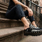 Handmade zebra print leather wedge mule clogs with silver buckle, studs and 6 cm wenge wooden wedge by Sol Caleyo.