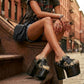 Blogger wearing Indian Snake Clogs with a white tank top and denim shorts, showcasing the 18cm platform height in an urban setting.