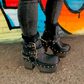 Black leather platform boots with silver studs. Black leather biker style boots with buckles. Black leather ankle boots with vintage style buckles. Leather boots with wooden heel. High-end handmade footwear by Sol Caleyo.