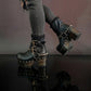 Black leather platform boots with silver studs. Black leather biker style boots with buckles. Black leather ankle boots with vintage style buckles. Leather boots with wooden heel. High-end handmade footwear by Sol Caleyo.