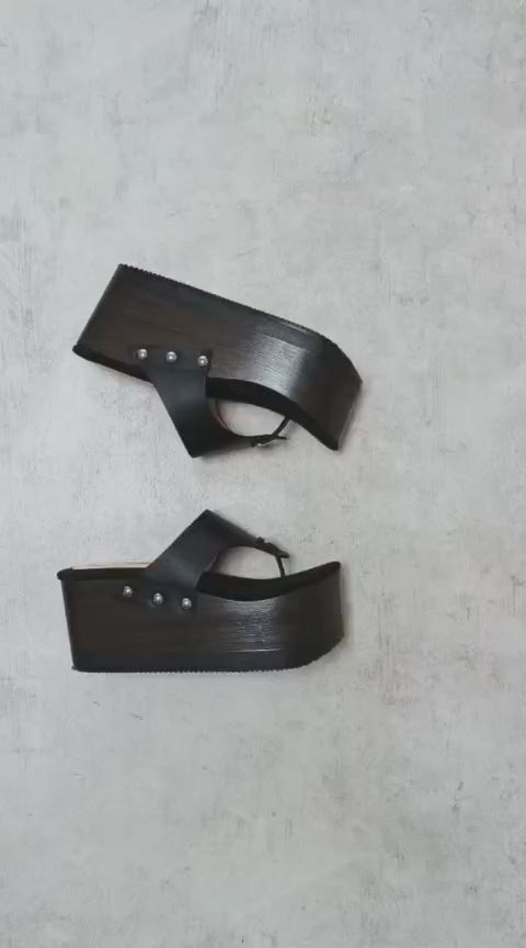 Black flip flop style platform clog sandal. Platform wedge. Black leather flip flop style sandal. Sizes 34 to 47. High quality leather shoes handmade by Sol Caleyo.