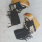 Leather clog boot with wooden wedge flip flop style. Leather flip flop style boot decorated with shells, coins and fringes which gives it an authentic Boho style. Leather flip flop with wooden wedge. Bohemian style leather boot. Sizes 34 to 47. High quality leather footwear handmade by sol Caleyo. Sustainable fashion.