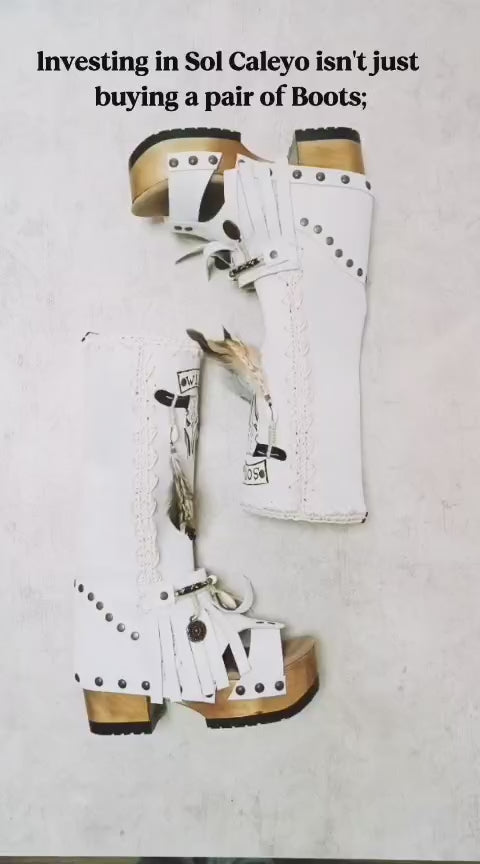 Meticulously handcrafted suede boots with 6cm heels and soft goatskin insoles. Bespoke artisan footwear by Sol Caleyo showing the detail of hand-painted embellishments and natural materials.