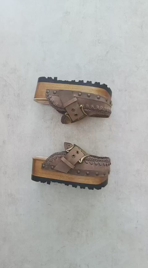 Video of handmade Oxford Vintage leather clogs in aged brown leather with hand-crocheted trim, antique brass buckle and wooden platform sole
