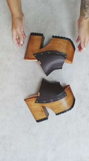 Video of the handmade Dubai dark brown leather platform mule sandals with antique-gold studs and a 13 cm natural wooden heel, by Sol Caleyo