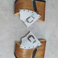 Experience the ultimate statement in bohemian luxury with the Sol Caleyo White Western Sandals. Exclusively handcrafted to order, these extreme platform clogs feature a 17 cm heel and an 11 cm platform, meticulously carved from genuine wood.

Made with premium textured white full-grain leather and adorned with antique silver Western hardware, this nomadic-chic footwear combines high-fashion aesthetics with artisanal durability. Available in sizes 33 to 47.

Key Features:

100% Handcrafted to order (Sustaina