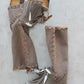 Bohemian-style boots in earth-colored suede leather. Bohemian-style platform boots, decorated with horns, fringes, feathers, and shells. High-end footwear handmade to order. Exclusive design by Sol Caleyo.