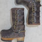 Handmade leather clogs. Dark brown leather biker boots. Leather boots with wooden heels. Leather boots with buckles. High-end footwear handmade by Sol Caleyo.