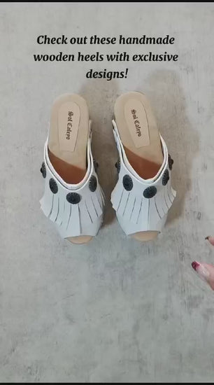 White leather sandal. White leather sandal boho style. White leather sandal decorated with fringes and silver conchos with a unique boho style. Wooden clog sandals with super high heels 70's style. Sizes 34 to 47. High quality handmade leather shoes by sol Caleyo. Sustainable fashion.