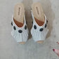 White leather sandal. White leather sandal boho style. White leather sandal decorated with fringes and silver conchos with a unique boho style. Wooden clog sandals with super high heels 70's style. Sizes 34 to 47. High quality handmade leather shoes by sol Caleyo. Sustainable fashion.