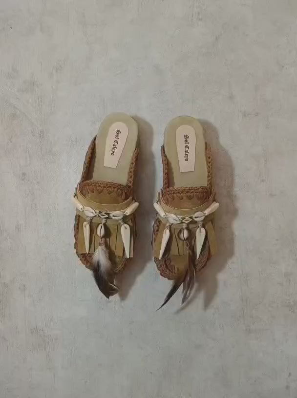 Moccasin style clogs, vintage style wooden wedge clogs. Bohemian style clogs, decorated with feathers, natural shells and horns. Moccasin clogs handmade by Sol Caleyo.