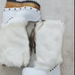 White fur boots with wooden wedge. White bohemian style leather boots. Handmade clogs shoes. White fur boots decorated with feathers, natural shells and horns. High-end handmade footwear by Sol Caleyo. Handmade Furry Shoes.