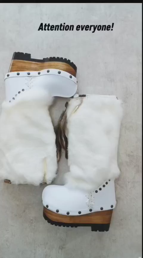 White fur boots with wooden wedge. White bohemian style leather boots. Handmade clogs shoes. White fur boots decorated with feathers, natural shells and horns. High-end handmade footwear by Sol Caleyo. Handmade Furry Shoes.