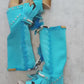 Turquoise bohemian-style boots, handmade. Platform boots with wooden heel. Turquoise bohemian-style boots decorated with feathers, shells and carved bone. High-end footwear handmade by Sol Caleyo.