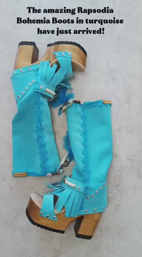 Turquoise bohemian-style boots, handmade. Platform boots with wooden heel. Turquoise bohemian-style boots decorated with feathers, shells and carved bone. High-end footwear handmade by Sol Caleyo.