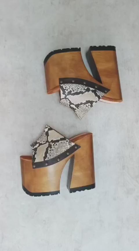 Handcrafted Snake Luxury Queen Sandals by Sol Caleyo featuring exotic snake-print leather, 17cm bell heel, and 11cm hand-carved wooden platform on a white background.