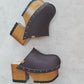 Brown leather clogs in a vintage 70s style. Super high vintage-style wooden heel. Sizes 33 to 47. High-end footwear handmade by Sol Caleyo.