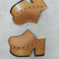 Brown leather clogs in a vintage 70s style. Super high vintage-style wooden heel. Sizes 33 to 47. High-end footwear handmade by Sol Caleyo.