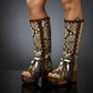 AI model wearing handmade bohemian snake leather platform boots with wooden heel and feather details by Sol Caleyo