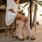 Model wearing Kozani Pink festival boots in a boho-chic summer outfit with a vintage-inspired look