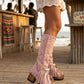 Model wearing Kozani Pink festival boots in a boho-chic summer outfit with a vintage-inspired look.
