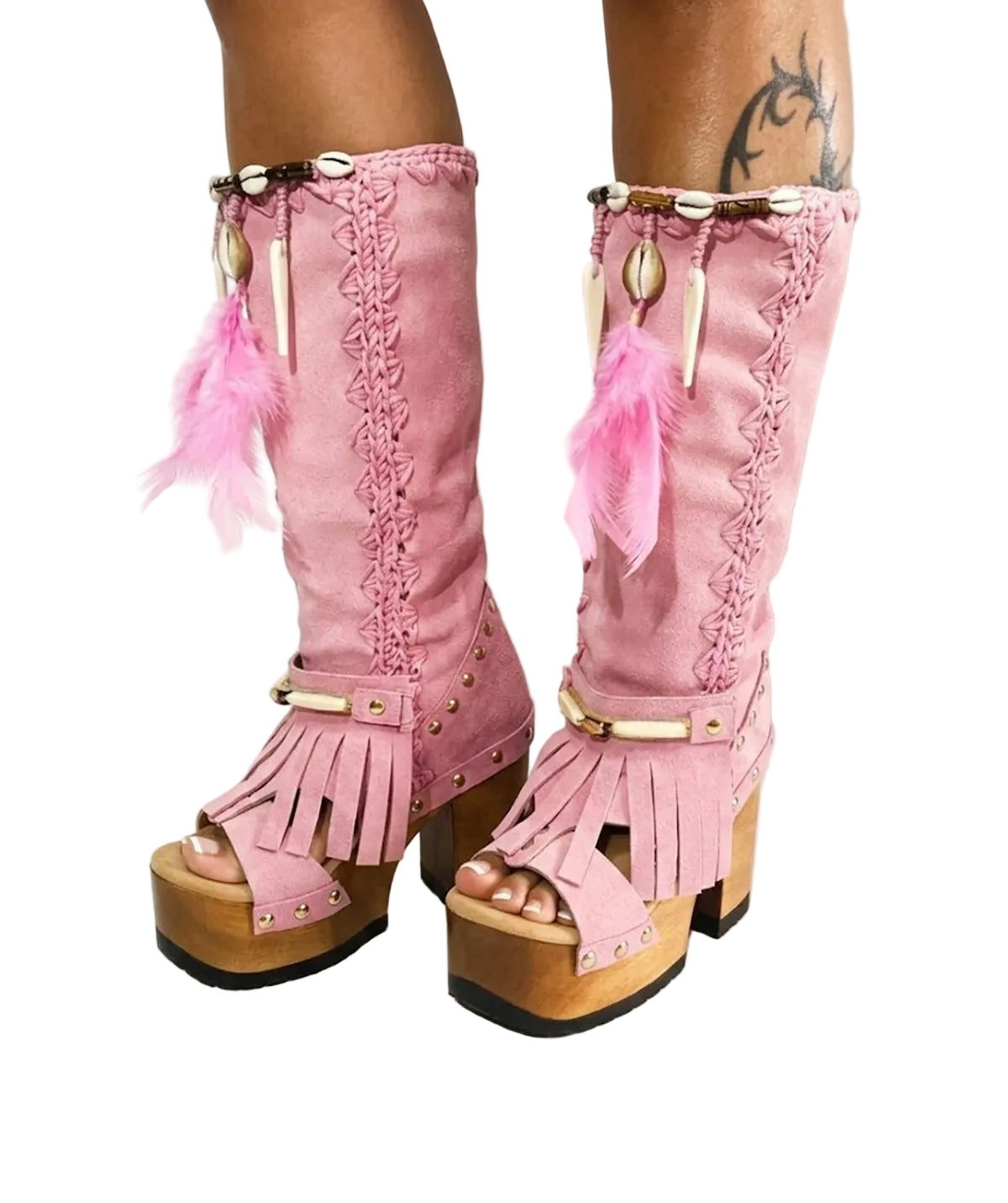 Close-up of Rhapsody Bohemia Pink Boots in premium pink suede with fringe, hand-selected feathers, and organic shells. These artisanal boho boots by Sol Caleyo feature a high hand-sculpted wooden heel and platform.